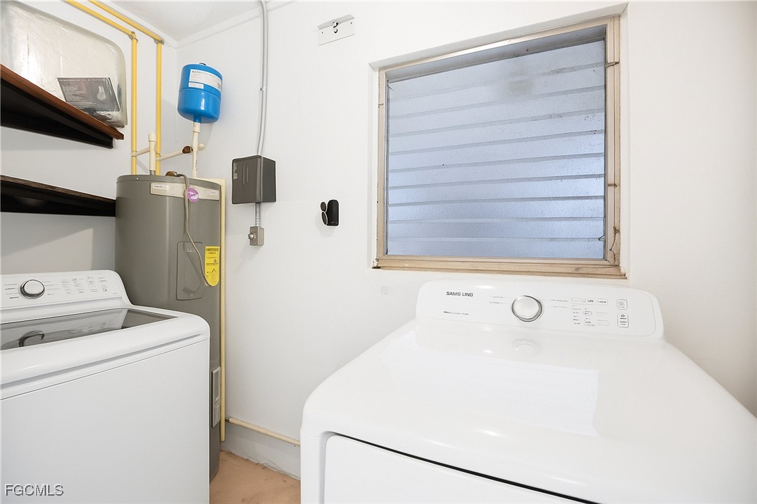 1440 Mandel Road Fort Myers, FL 33919 - Photo 22 of 40 a utility room with dryer and washer
