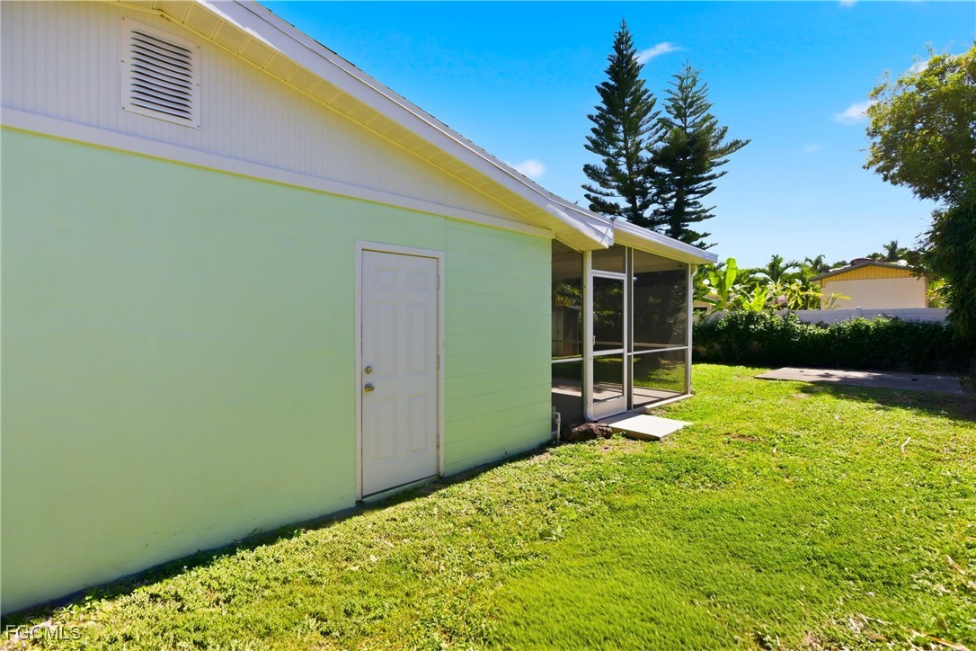 1440 Mandel Road Fort Myers, FL 33919 - Photo 28 of 40 a view of a backyard with a garden