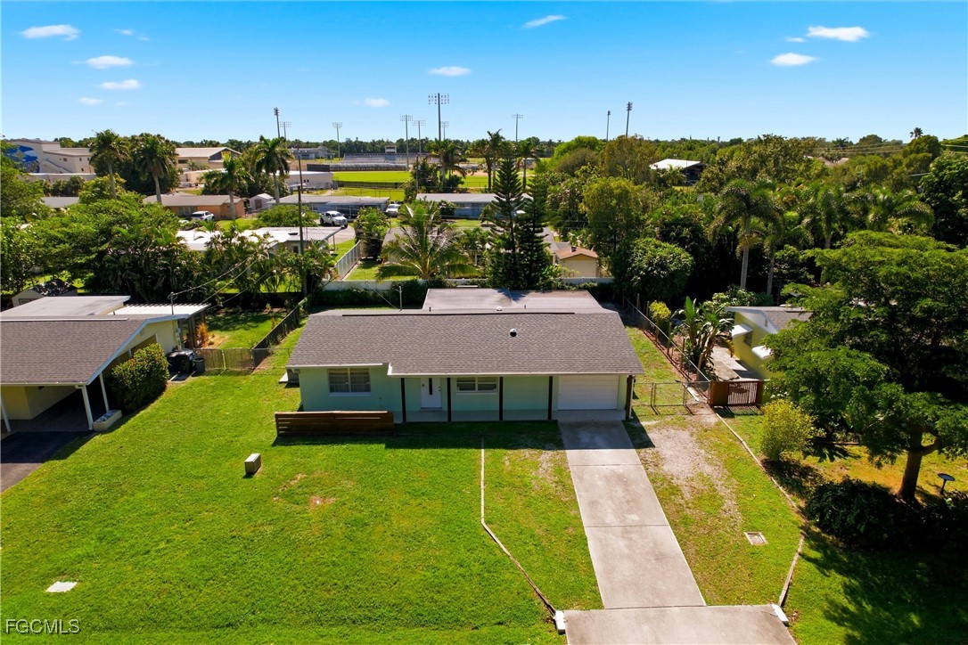 1440 Mandel Road Fort Myers, FL 33919 - Photo 33 of 40 a view of a swimming pool and trees in the background