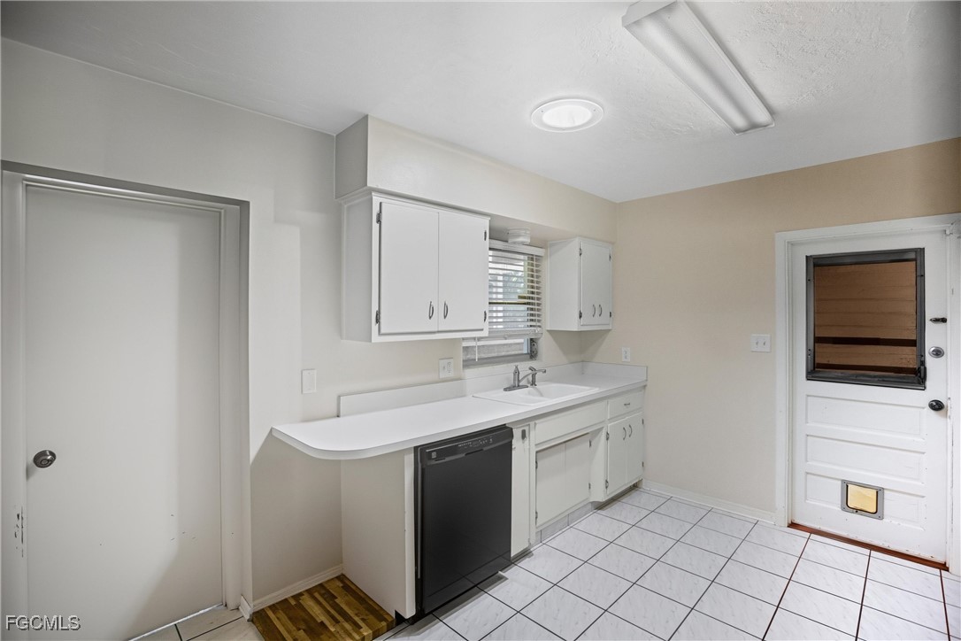 1440 Mandel Road Fort Myers, FL 33919 - Photo 8 of 40 a bathroom with a sink a toilet and mirror