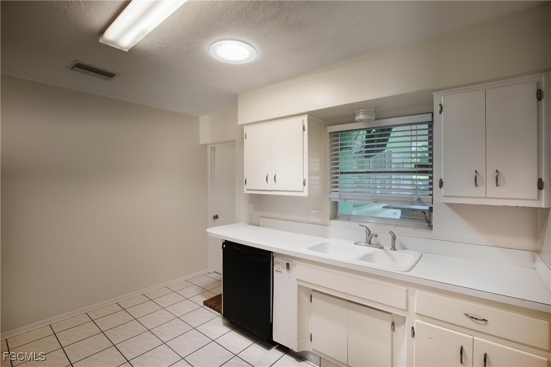 1440 Mandel Road Fort Myers, FL 33919 - Photo 9 of 40 a bathroom with a sink and a mirror