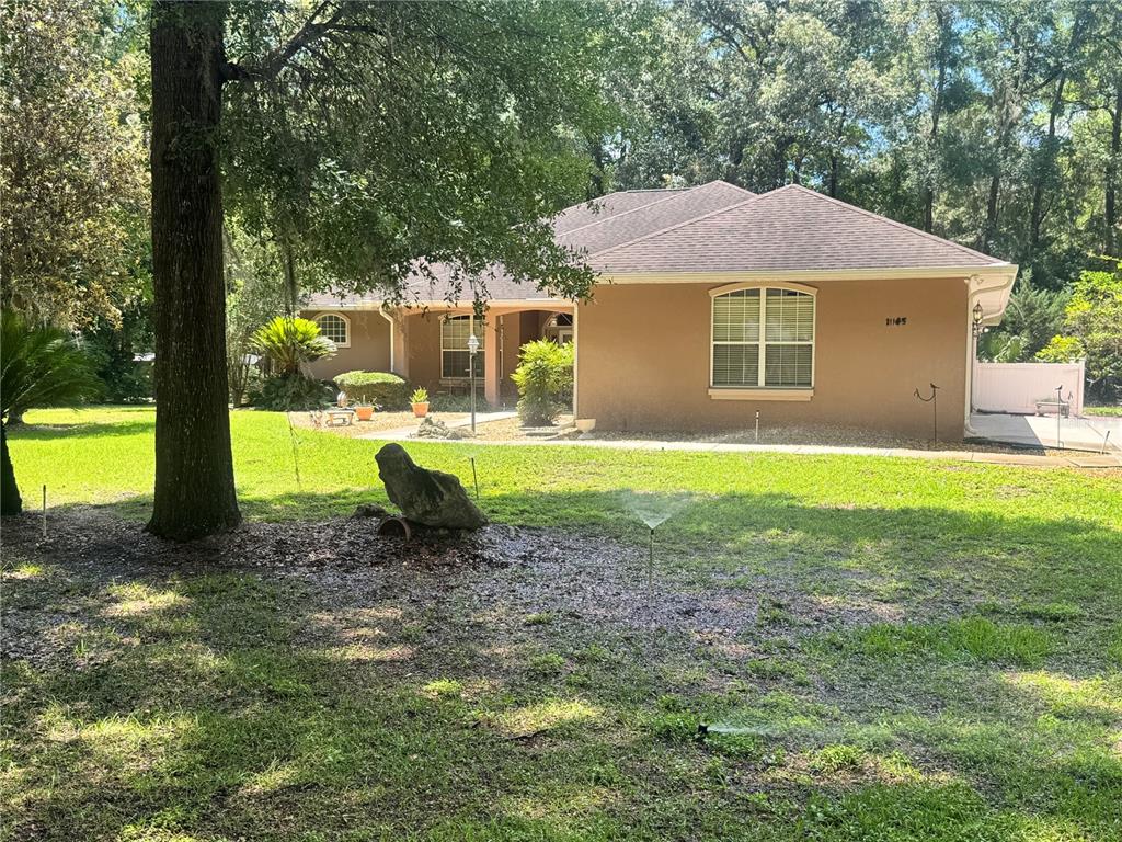 11145 Northwest 17th Court Road Ocala, FL 34475 - Photo 11 of 59 a view of a house with a yard and sitting area