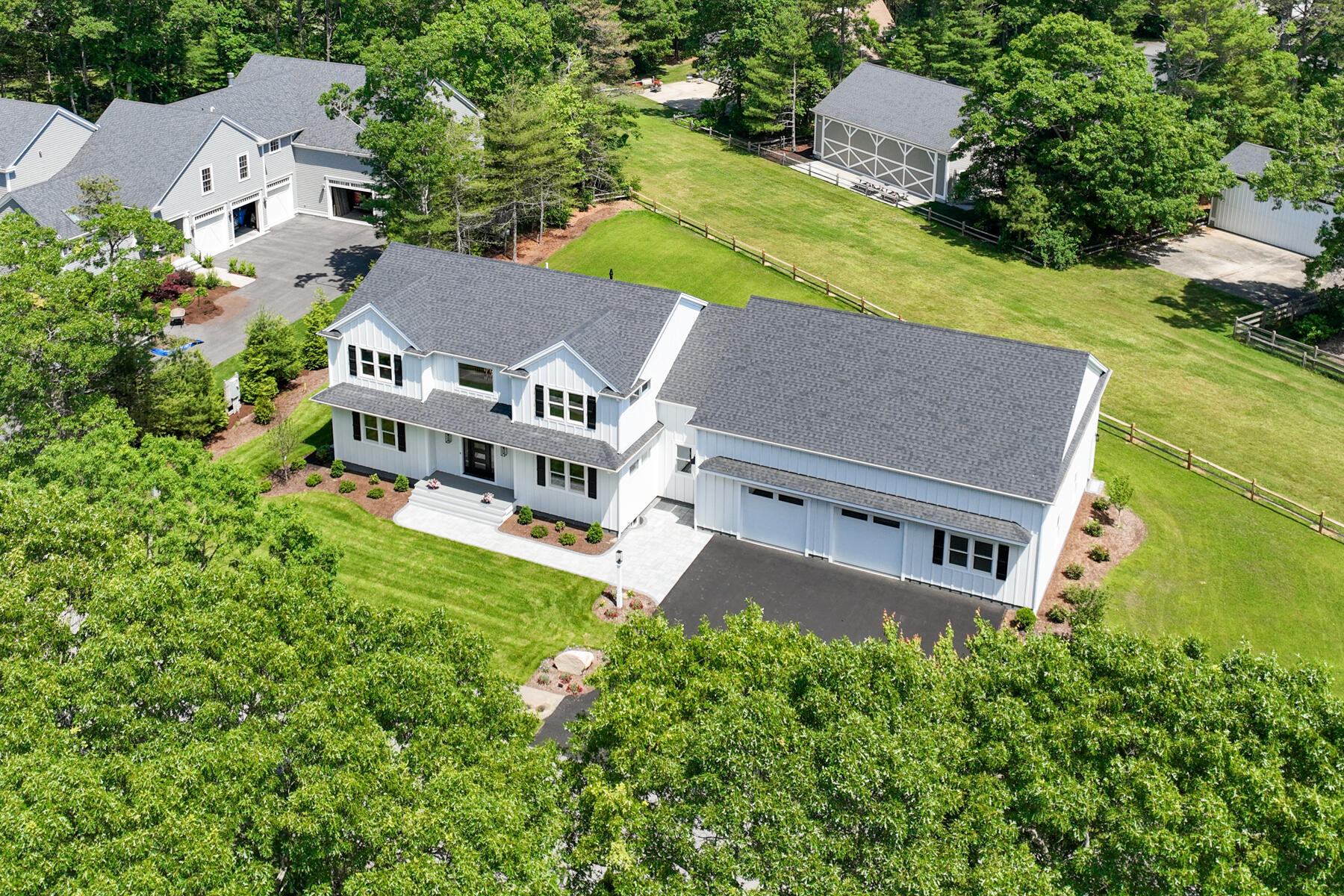 144 Rickenbacker Road East Falmouth, MA 02536 - Photo 1 of 50 an aerial view of a house with a garden