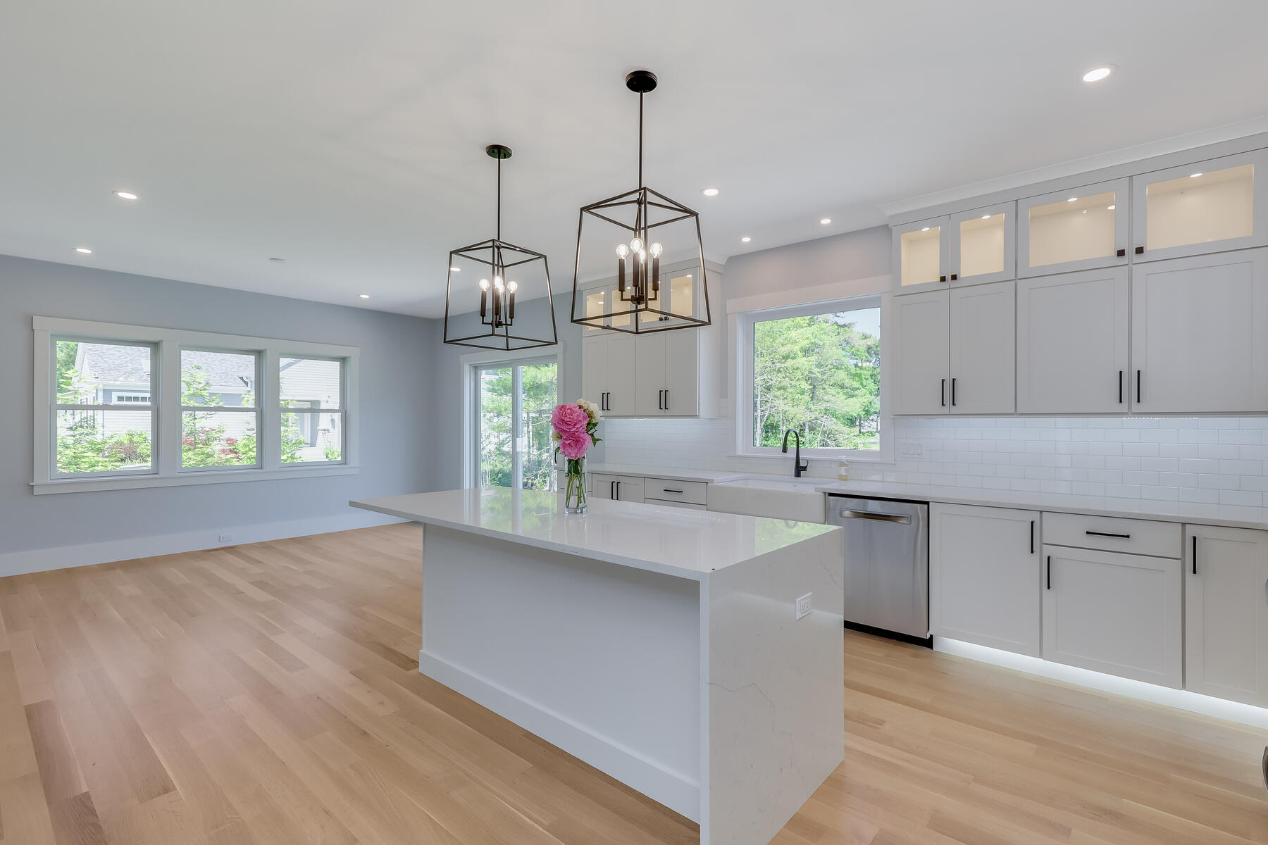 144 Rickenbacker Road East Falmouth, MA 02536 - Photo 12 of 50 a kitchen with kitchen island granite countertop a sink cabinets and window