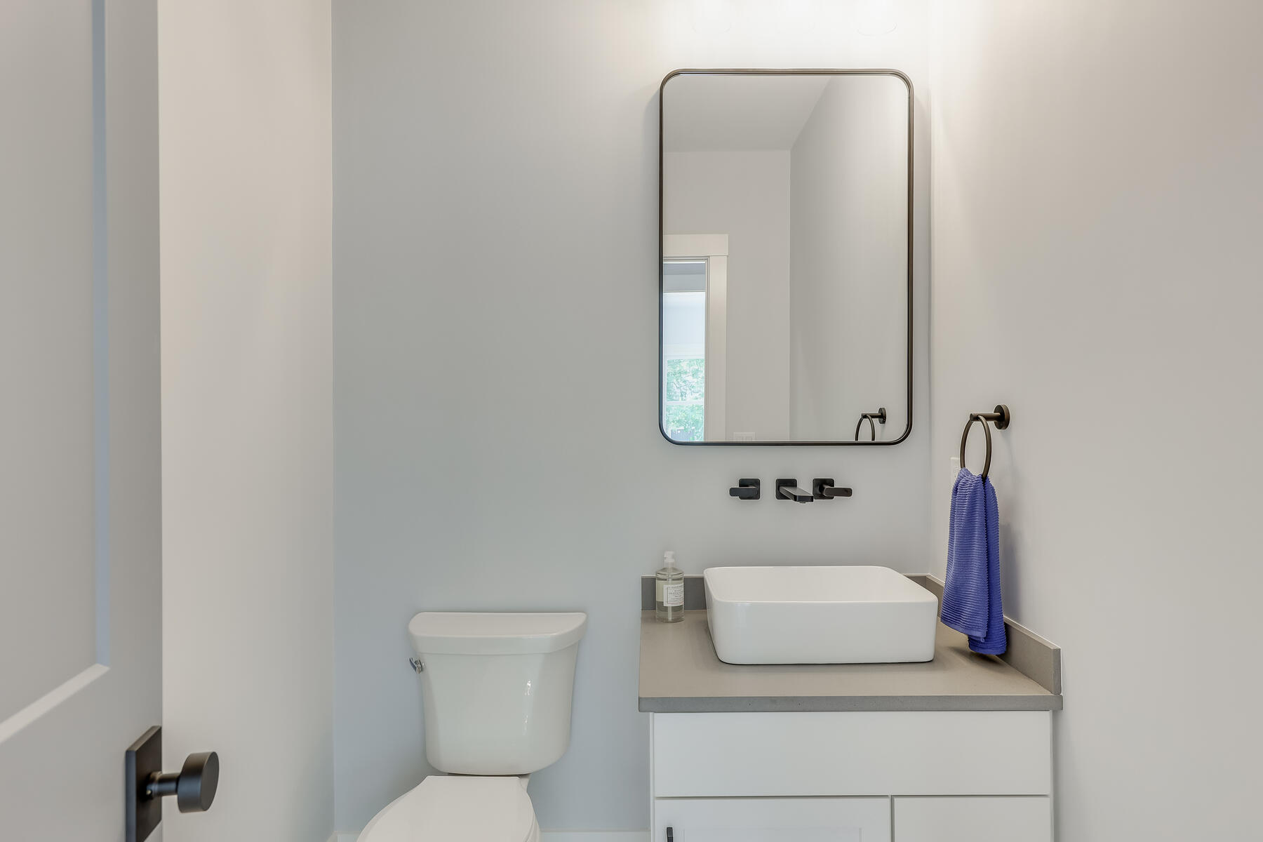 144 Rickenbacker Road East Falmouth, MA 02536 - Photo 23 of 50 a bathroom with a toilet sink and mirror