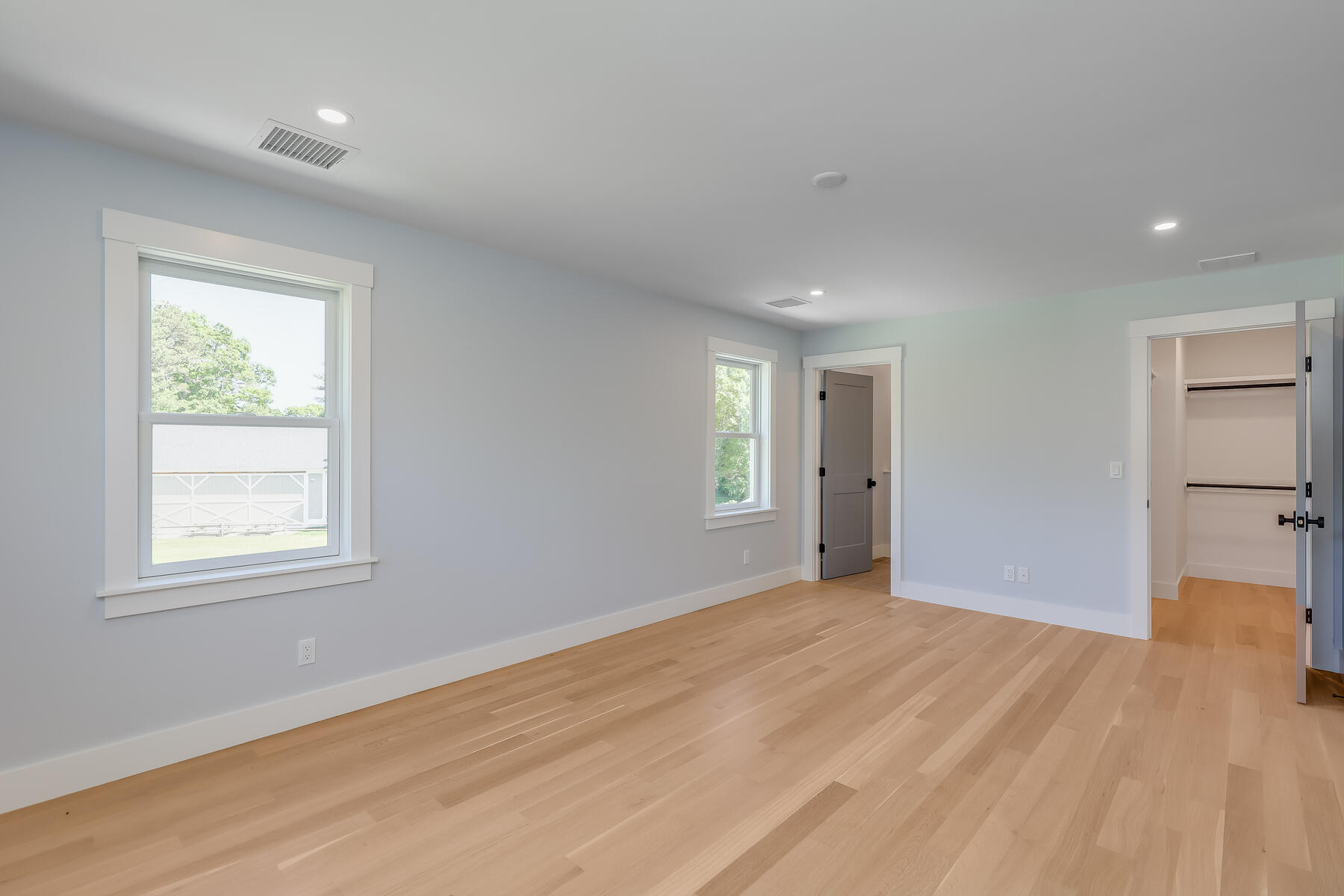 144 Rickenbacker Road East Falmouth, MA 02536 - Photo 33 of 50 a view of empty room with wooden floor and fan