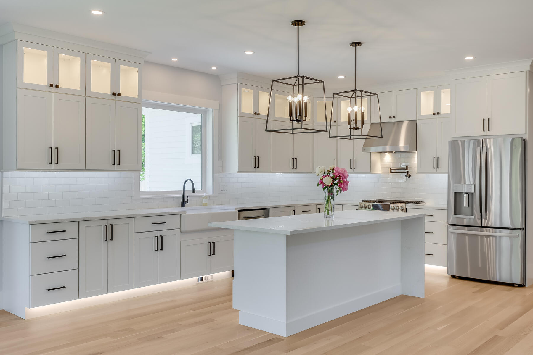144 Rickenbacker Road East Falmouth, MA 02536 - Photo 9 of 50 a kitchen with white cabinets stainless steel appliances and kitchen island