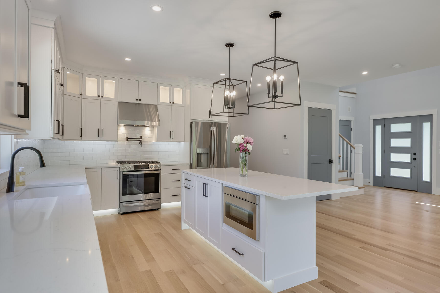 144 Rickenbacker Road East Falmouth, MA 02536 - Photo 10 of 50 a large kitchen with stainless steel appliances granite countertop a sink a stove and a refrigerator