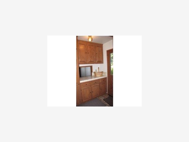 4080 Crest Road Pebble Beach, CA 93953 - Photo 3 of 9 a hallway with a white cabinet