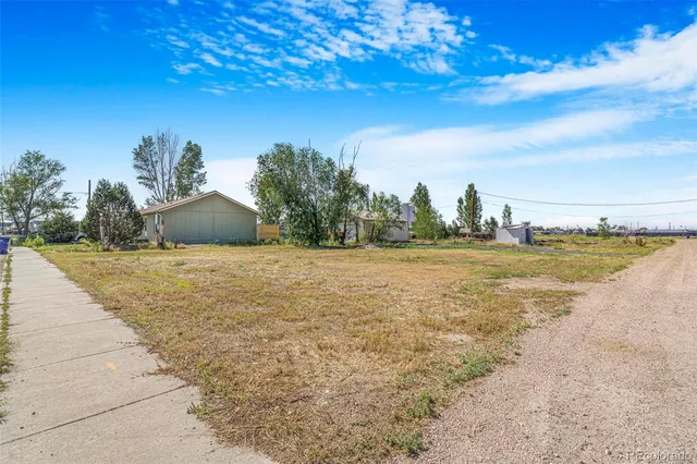 a view of a lake with a yard