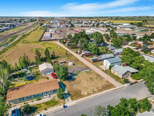 an aerial view of residential houses and city street