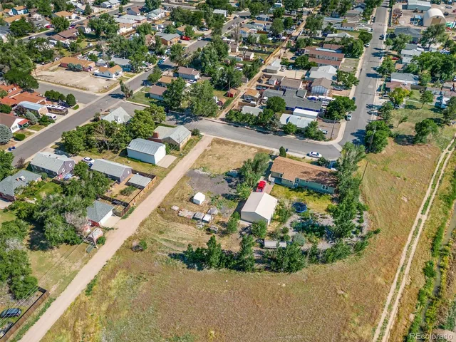 an aerial view of a house with a garden