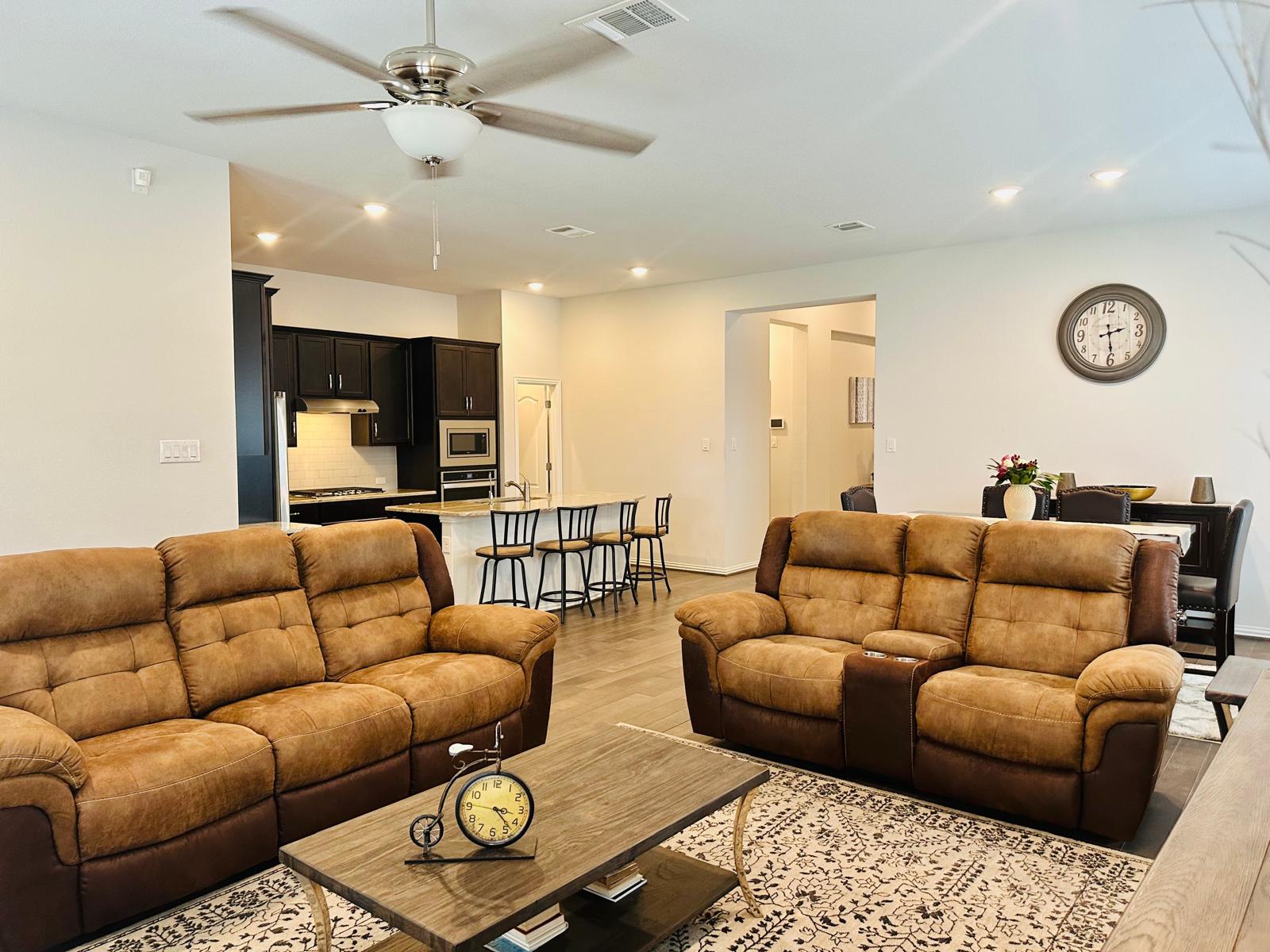 862 Leadtree Loop Buda, TX 78610 - Photo 11 of 40 a living room with furniture ceiling fan and a rug