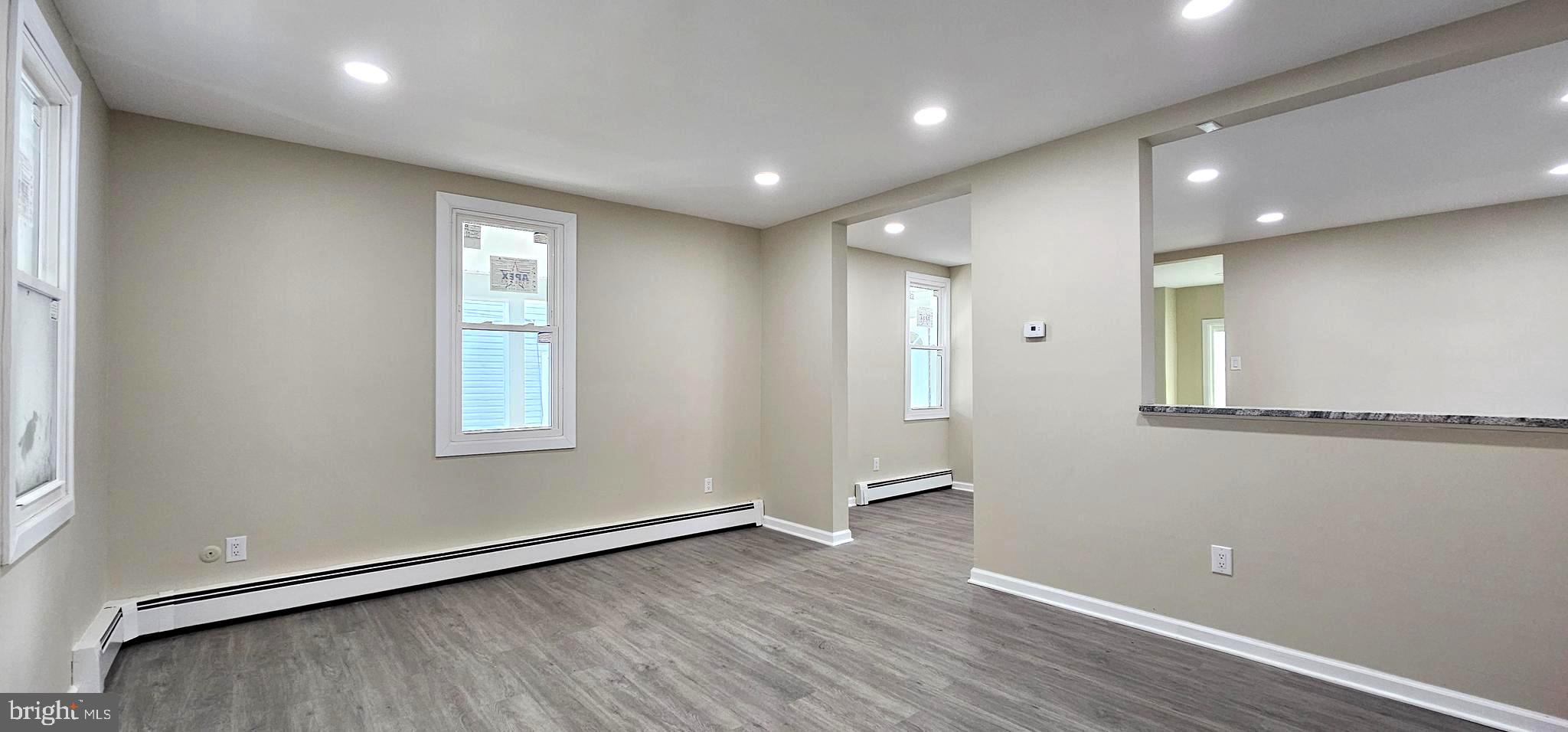 36 Maple Avenue Hatfield, PA 19440 - Photo 12 of 23 an empty room with wooden floor and windows