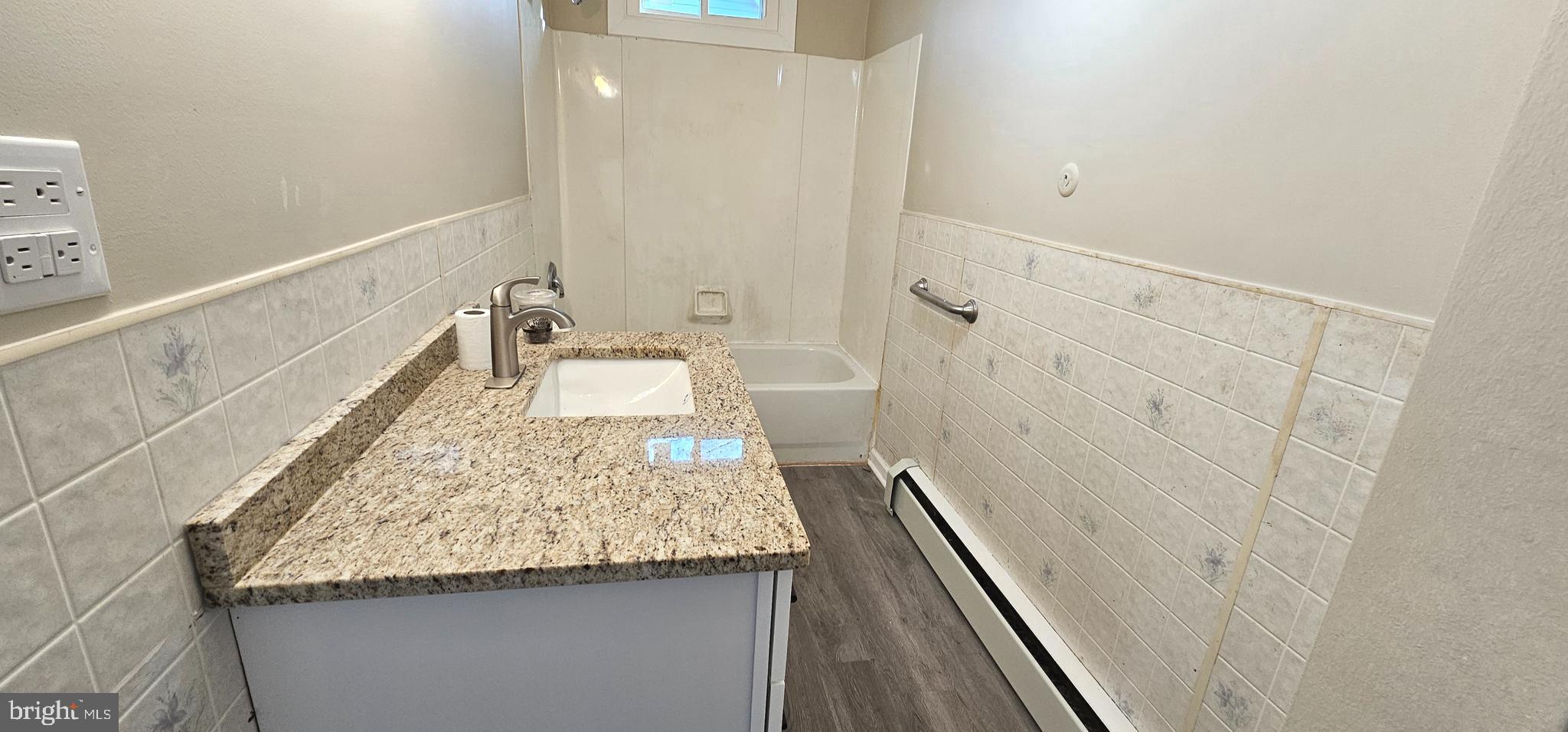 36 Maple Avenue Hatfield, PA 19440 - Photo 14 of 23 a bathroom with a granite countertop sink and a mirror