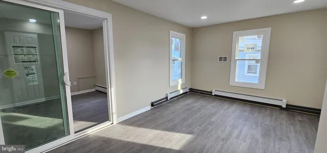 wooden floor in an empty room and a window