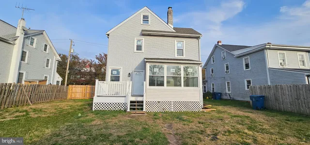a view of house with backyard