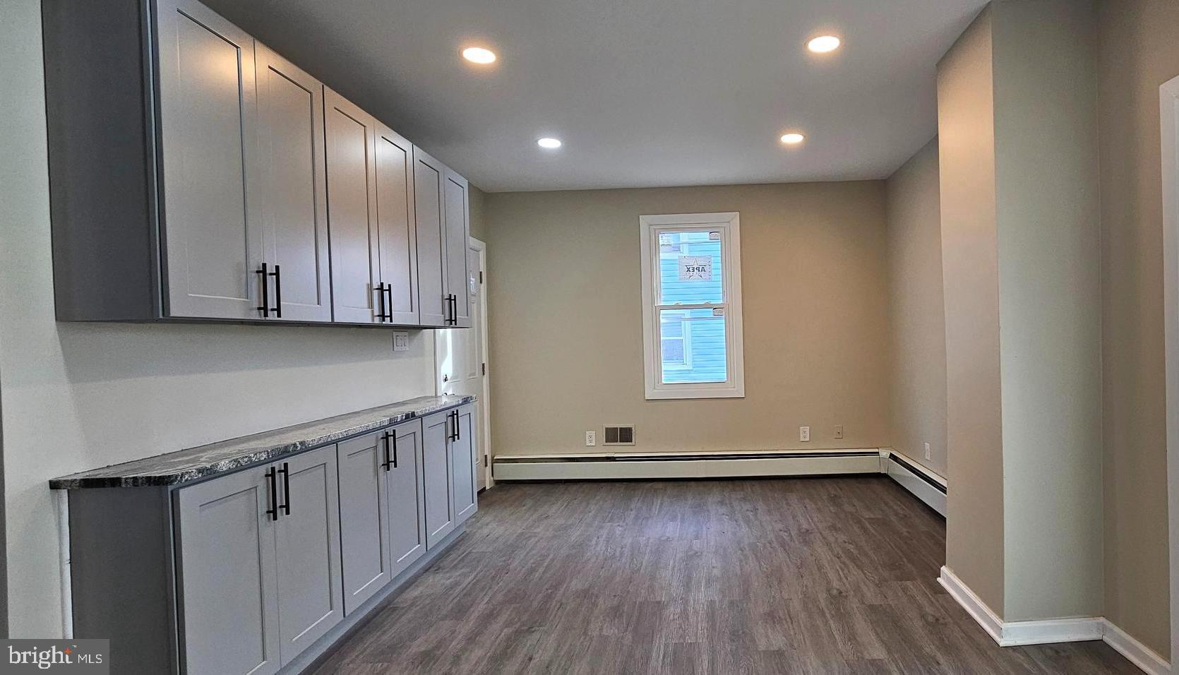 36 Maple Avenue Hatfield, PA 19440 - Photo 8 of 23 an empty room with wooden floor and windows