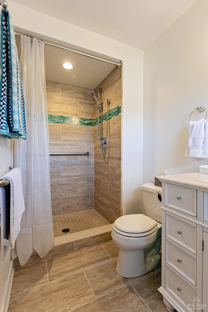 304 Warwick Drive Naperville, IL 60565 - Photo 19 of 41 a bathroom with a toilet and a shower