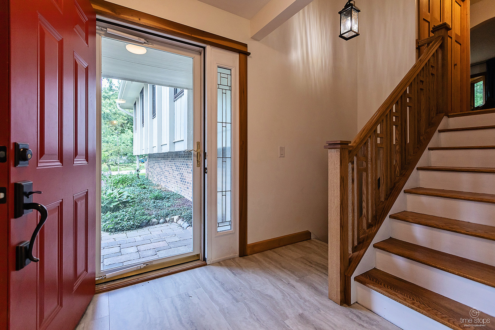 304 Warwick Drive Naperville, IL 60565 - Photo 2 of 41 a view of entryway with wooden floor and door