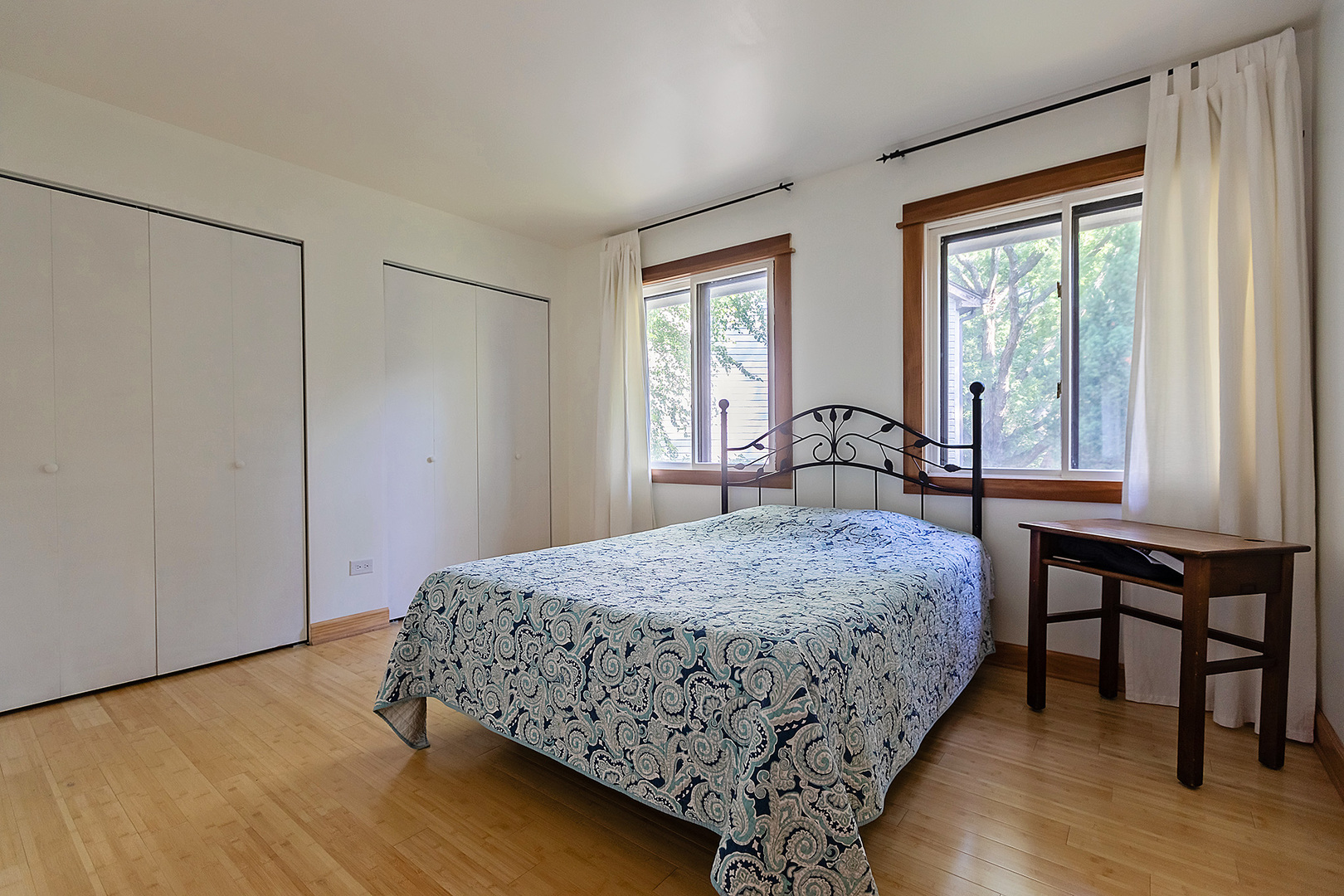 304 Warwick Drive Naperville, IL 60565 - Photo 23 of 41 a bedroom with a bed and a table in it