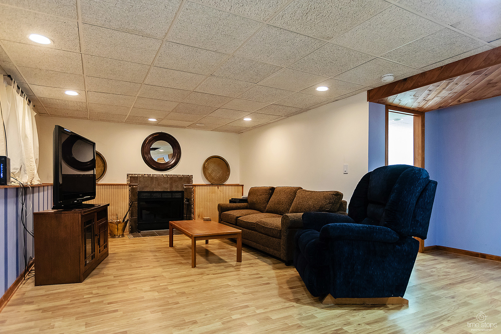 304 Warwick Drive Naperville, IL 60565 - Photo 26 of 41 a living room with furniture and a fireplace
