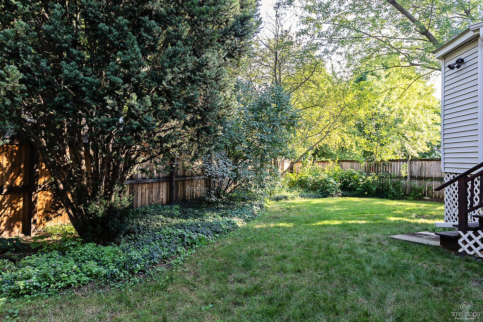 304 Warwick Drive Naperville, IL 60565 - Photo 37 of 41 a view of a backyard with large trees