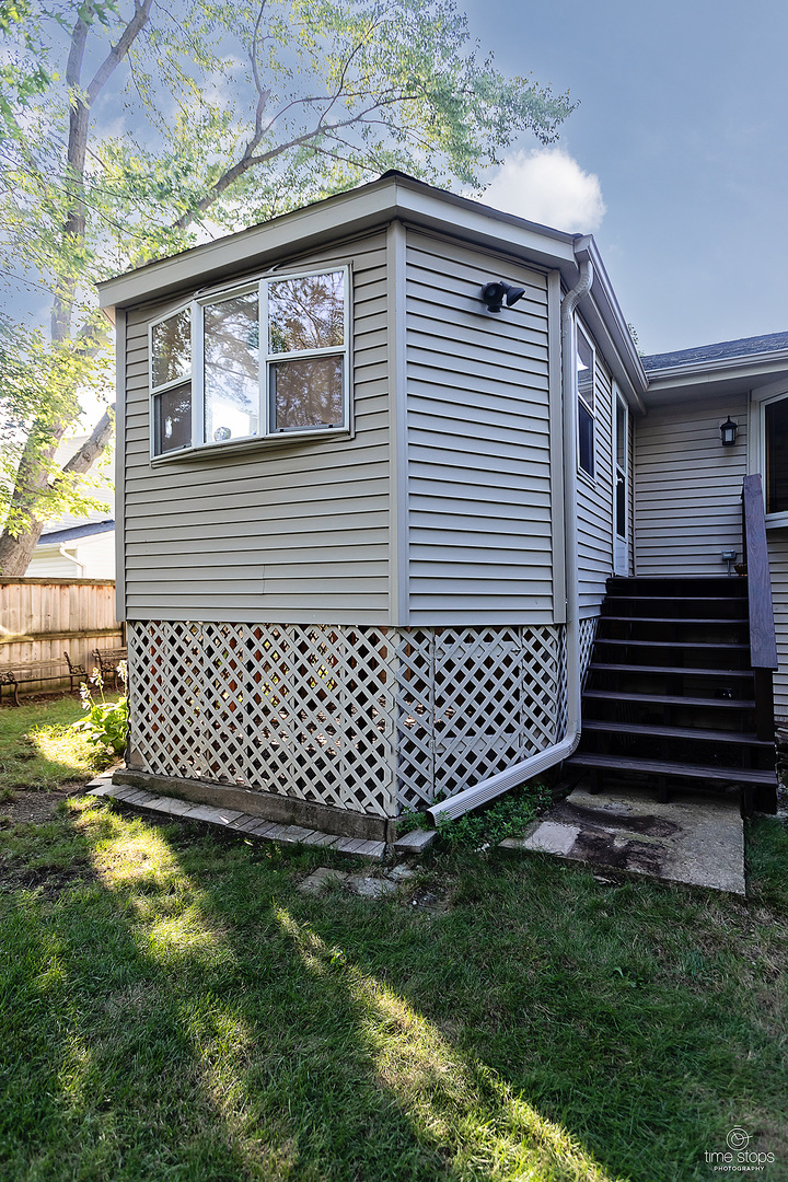 304 Warwick Drive Naperville, IL 60565 - Photo 39 of 41 a front view of a house with a garden