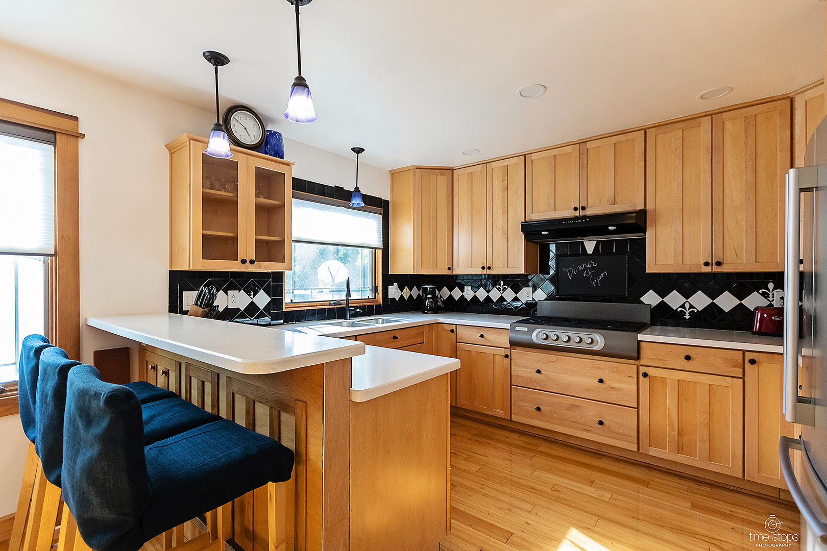 304 Warwick Drive Naperville, IL 60565 - Photo 7 of 41 a kitchen with stainless steel appliances granite countertop a stove a sink dishwasher and a refrigerator with wooden floor