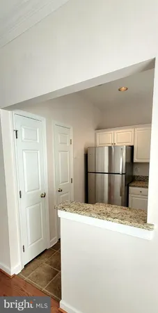 a kitchen with a stove a sink and a counter top space