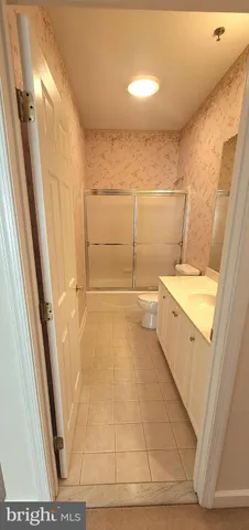 an empty room with closet and empty shelves