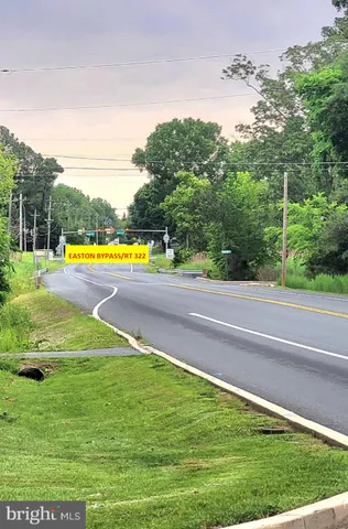a view of a swimming pool with a yard