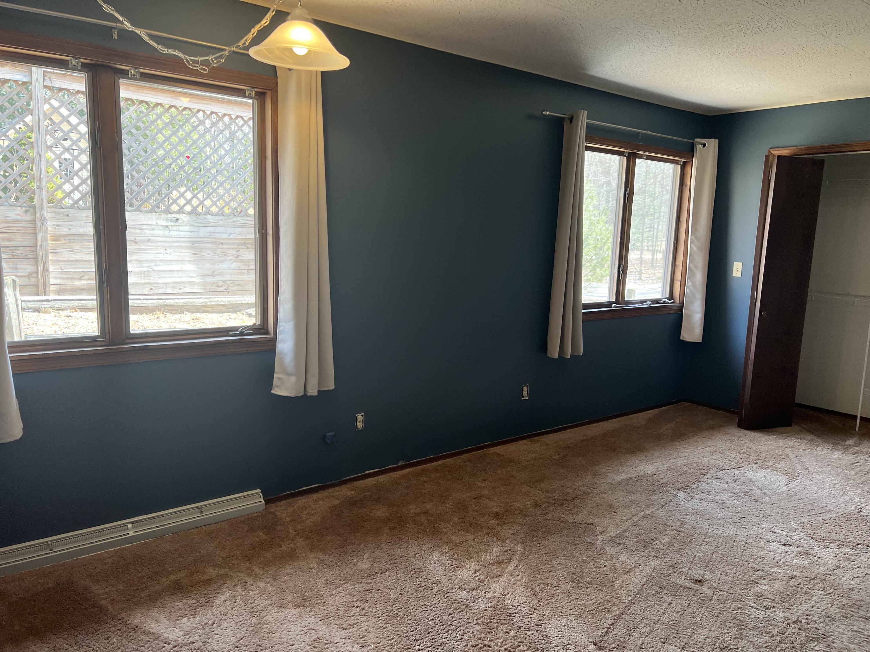 6820 West Travis Road Ludington, MI 49431 - Photo 21 of 39 Primary Bedroom