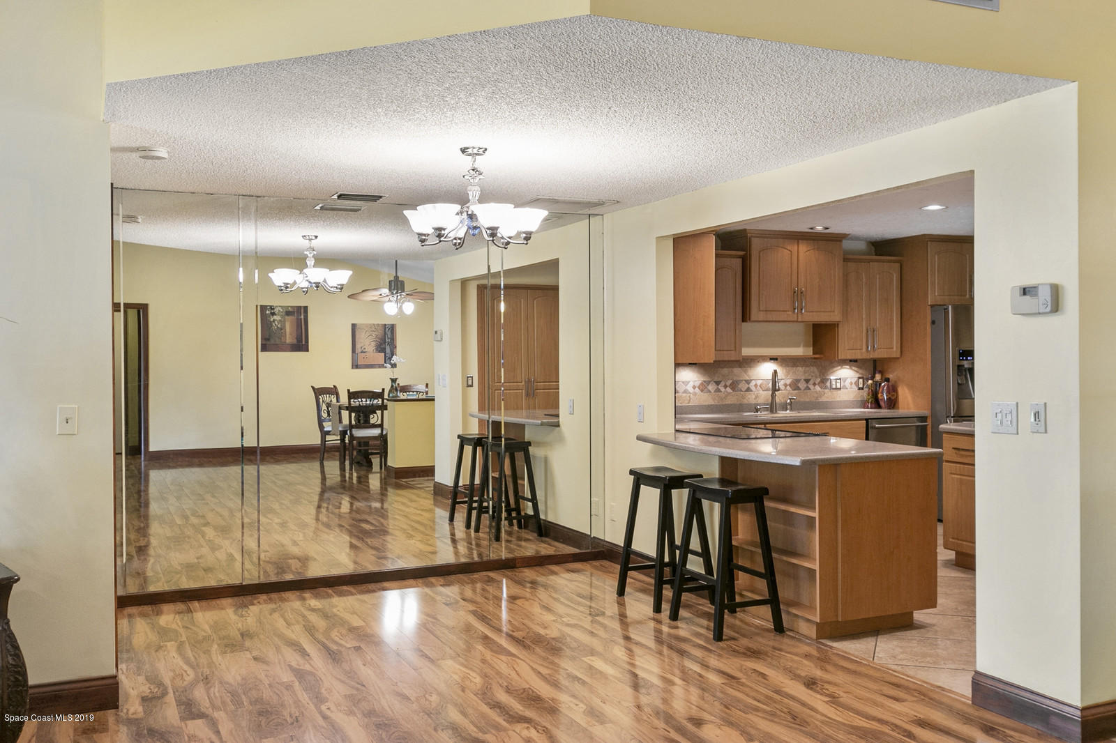 1320 Meadowbrook Road Northeast Palm Bay, FL 32905 - Photo 11 of 34 Open to Kitchen
