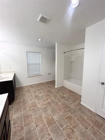 a view of an empty room with a fireplace