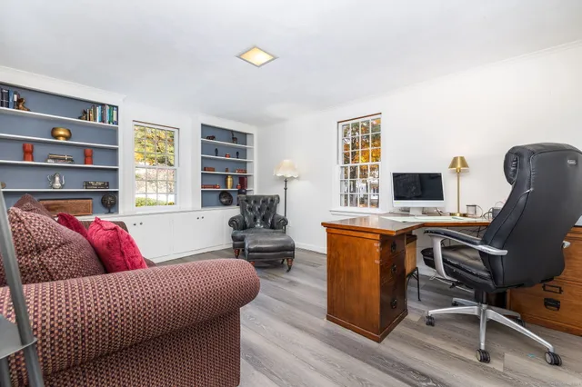 a living room with furniture rug and window