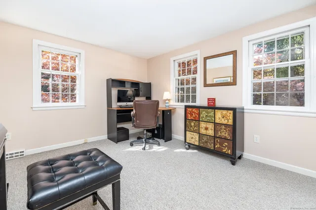 a workspace with furniture and a window