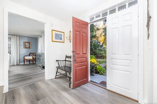 a view of a livingroom with furniture and wooden floor