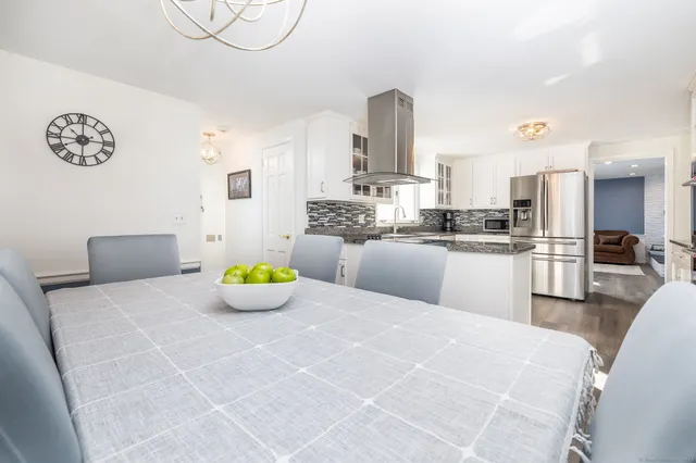 a kitchen with a sink a counter top space and appliances