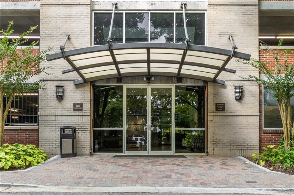 3180 Mathieson Drive Northeast, Unit 1010 Atlanta, GA 30305 - Photo 2 of 44 a view of a patio with a table and chairs and potted plants