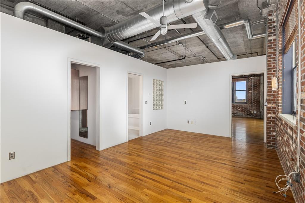 3180 Mathieson Drive Northeast, Unit 1010 Atlanta, GA 30305 - Photo 21 of 44 a view of an empty room with wooden floor