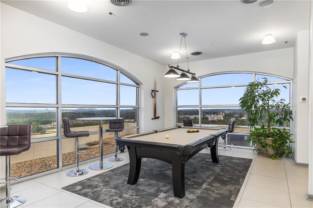 3180 Mathieson Drive Northeast, Unit 1010 Atlanta, GA 30305 - Photo 30 of 44 a room with pool table and windows