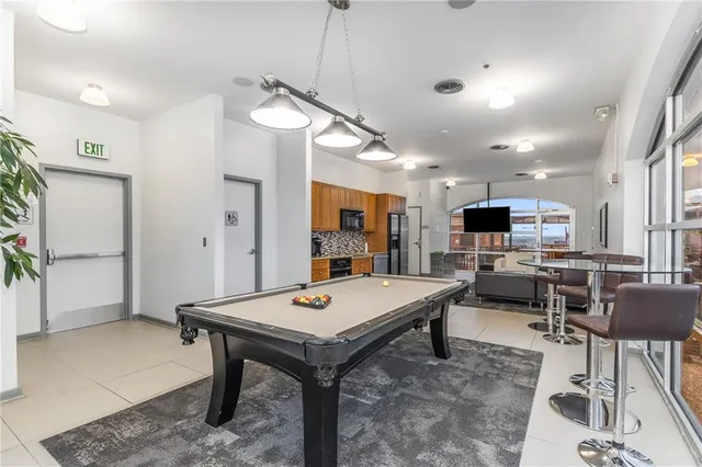 a room with gym equipment and a large window