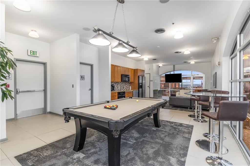 3180 Mathieson Drive Northeast, Unit 1010 Atlanta, GA 30305 - Photo 31 of 44 a view of kitchen and dining area with furniture