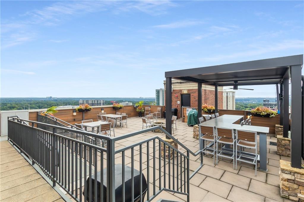 3180 Mathieson Drive Northeast, Unit 1010 Atlanta, GA 30305 - Photo 35 of 44 a view of a balcony with chairs