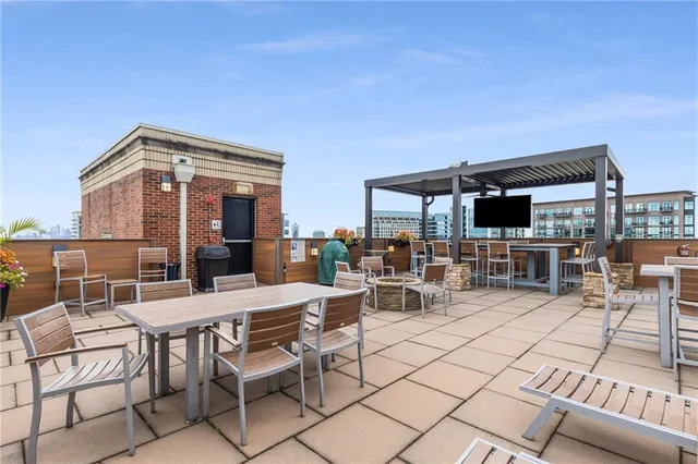 a view of a terrace with wooden floor and bench