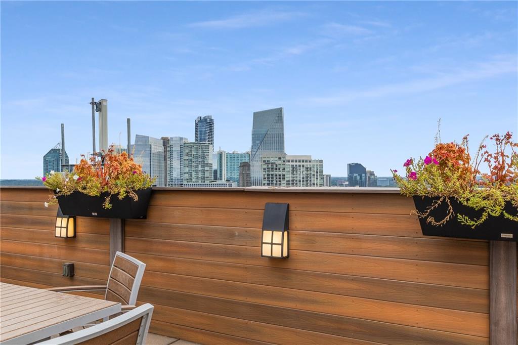 3180 Mathieson Drive Northeast, Unit 1010 Atlanta, GA 30305 - Photo 40 of 44 a view of a terrace with wooden floor and bench