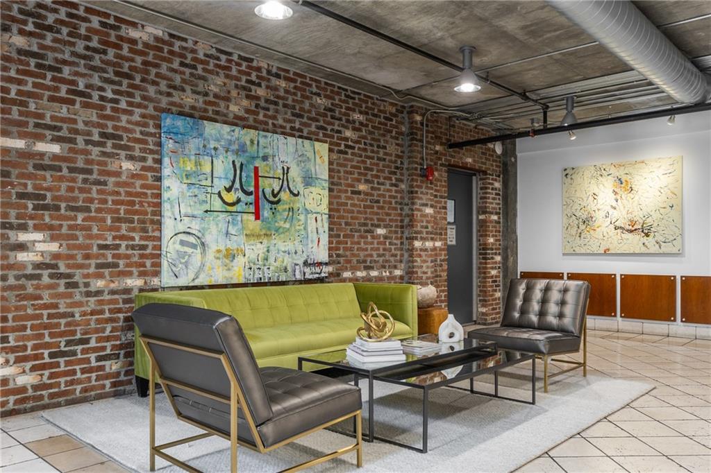 3180 Mathieson Drive Northeast, Unit 1010 Atlanta, GA 30305 - Photo 4 of 44 a living room with furniture and a bathtub