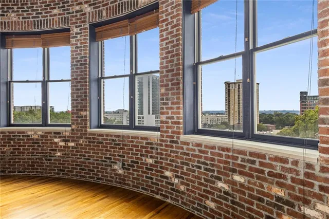 a view of a room with wooden floor