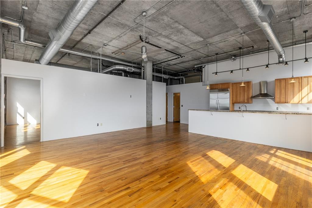 3180 Mathieson Drive Northeast, Unit 1010 Atlanta, GA 30305 - Photo 9 of 44 a view of a room with wooden floor
